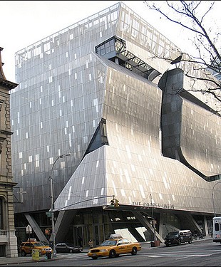 The new Cooper Union building, by architect Thom Mayne. Is that a distortion
in the photo, or is the building to the left shrinking back?
(Image source)