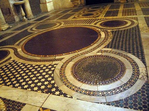 Cosmatesque Quincunx at S. Maria in Cosmedin. The central roundel was often made of porphyry to symbolize Christ's royalty. See Paloma's book Cosmatesque Ornament for more.