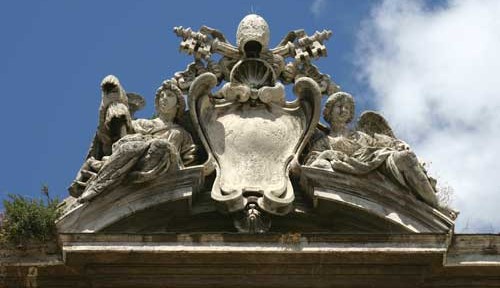 The Papal coat of arms, flanked by angels.