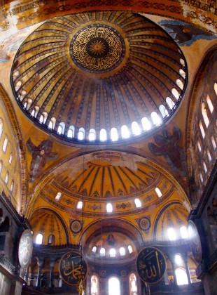 The pendentives of the Hagia Sophia are decorated with Seraphim, the highest of the choirs of angels, with six wings and many eyes (Revelation 4:8). They support the dome of Heaven.
[Image source]