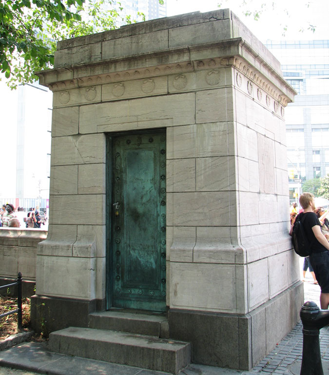 The sturdy gate houses each have a bronze door on one side and bas-reliefs on the other three. The simpler entablatures are decked with shells.